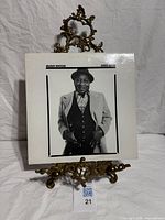 Front cover on stand showing artist portrait and title