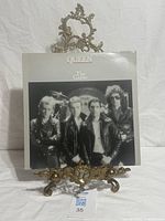Front cover of Queen The Game LP on stand
