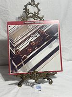 Front cover of The Beatles 1962-1966 album on stand