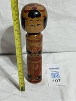 Front view with measuring tape showing height about 9 inches