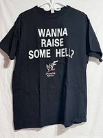 Full view front of black T-shirt with slogan and WWF logo