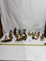 Group shot of all celluloid figures, measurement tape visible