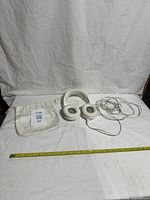 Full view of headphones, cable and pouch laid out