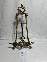 Full view of brass easel stand front