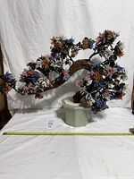 Full view of gemstone bonsai tree in ceramic pot with tape for scale