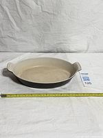 Top angled view showing full dish and measuring tape