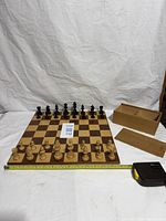 Full view of board, pieces setup, storage box