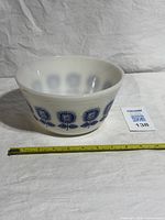 Side view showing full bowl and tape measure indicating size