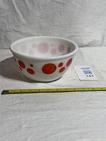 Full side view showing red dot pattern and scale