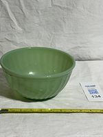 Jadeite Fire-King mixing bowl front view with tape for scale