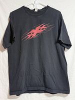 Front view of black t-shirt with red xXx logo