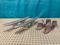 Pair of cleats and pair of fairleads side by side