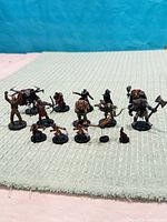 Group shot of all 15 D&D miniatures on mat