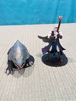 Front view of both miniatures side by side