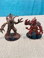Front view of both miniatures side by side