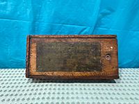 Closed wooden box with label