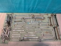 Entire assortment laid out showing quantity and variety of wrenches