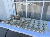 Full set displayed on table outdoors