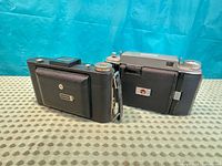 Rear view of both folded Kodak cameras