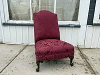 Front angled view showing full chair, upholstery pattern, leg style