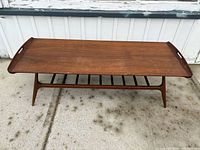 Full view of coffee table showing top, legs, and lower shelf