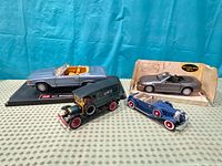 Group shot of all four model cars