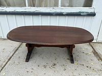 Top and base view of oval coffee table