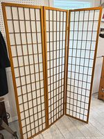 Full view of three-panel privacy screen standing open