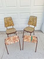 Full set: two chairs and two footrests in front of garage door