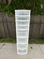 front view showing seven clear drawers in tower