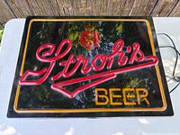 Front view showing full Stroh’s Beer illuminated sign face