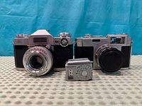 Front view of Zeiss Ikon Contaflex, Neoca 35 IVS and Sekonic meter
