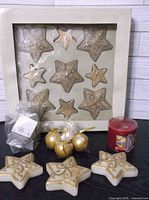 Full lot showing boxed star candles, Price's floating candles pack, gold ball candles, red pillar, loose star candles