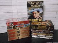 All items grouped: DVDs, VHS tapes, box sets visible