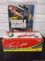 Boxed Terry Labonte car bank with sealed race program behind