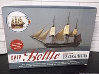 Front of boxed kit showing artwork of finished ship in bottle and product name