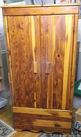 Front view of cedar wardrobe showing two doors and wood grain
