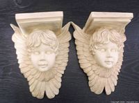 Front view of both matching cherub wall sconces