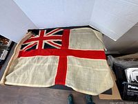 Entire flag displayed flat showing full design and rope hoist