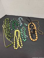 All eight necklaces laid out for overview