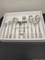 Closed box showing complete Sears 45-piece flatware set
