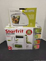 Both boxed items: HomeMax mini chopper and Starfrit spiralizer