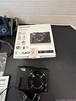 Camera and retail box showing model and lens