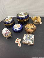 Group shot of all trinket boxes, mosaic cross and onyx birds