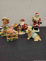 Group of five figurines showing overall lot contents