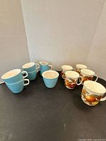 Group shot showing all Mikasa blue pieces and five fruit mugs
