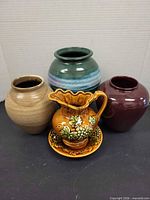Group shot of five ceramic pieces