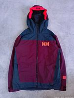 Front view of jacket showing colour scheme, full zipper, hood, HH logo