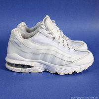 lateral side view of both sneakers showing colourway and Air unit