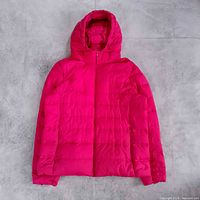 Full view of front of hot pink hooded down jacket